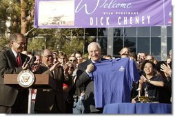 After congratulating NASA staff on the successful landing of the robotic rover Spirit on Mars, Vice President Dick Cheney holds up a shirt bearing the Spirit emblem at the Jet Propulsion Laboratory in Pasedena, Calif., Jan. 14, 2004. White House photo by David Bohrer.
