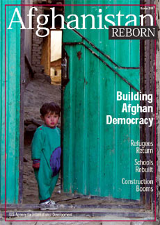 Front Cover: A gate opens in a Kabul neighborhood.  Photo: Jennifer Lindsey/USAID