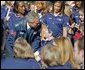 Wearing an Olympic jacket, President George W. Bush greets members of the 2004 U.S. Olympic and Paralympic Teams on the South Lawn Monday, Oct. 18, 2004. White House photo by Tina Hager.