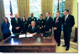 President George W. Bush signs HR 5467, The Department of Homeland Security Appropriations Act for the Fiscal Year 2005, in the Oval Office Monday, Oct. 18, 2004. White House photo by Tina Hager.