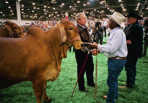 President George W. Bush greets a participant at the Houston Livestock Show and Rodeo Monday, March 8, 2004. White House photo by Eric Draper.
