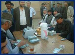 Photo: Old Afghanis are exchanged for the new currency printed by the countrys Central Bank.