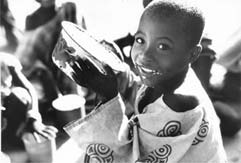 Photo of an African child with a bowl of food