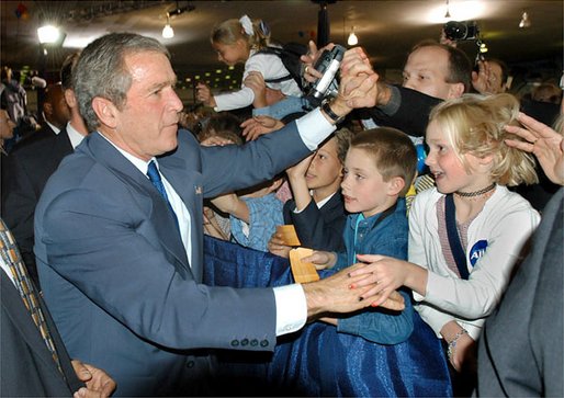 President George W. Bush greets audience members after speaking during the Colorado Welcome at the Wings Over The Rockies Air and Space Museum in Denver, Colo., Monday, Oct. 28. White House photo by Eric Draper.