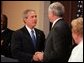 President George W. Bush congratulates Senator John Danforth as the new representative of the United States to the United Nations after a swearing-in ceremony in the Eisenhower Executive Office Building on July 1, 2004. White House photo by Paul Morse.