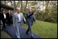 President George W. Bush escorts President Vladimir Putin of Russia after his arrival at Camp David, Friday, Sept. 26, 2003. White House photo by Eric Draper.